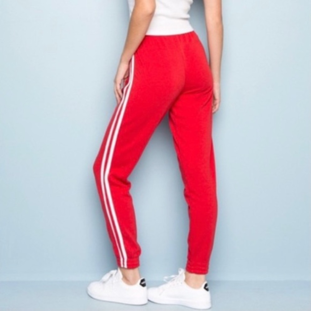 Red Brandy Melville sweatpants with white stripes